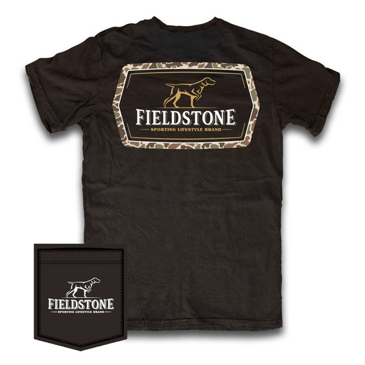 The Fieldstone Camo Logo Short Sleeve Pocket Tee delivers a blend of subtle camo style and classic black design. Crafted from 100% cotton for breathability and comfort, this tee showcases the Fieldstone logo on the front pocket and features the Fieldstone logo wrapped in a camo border featuring a German Shorthaired Pointer (GSP) graphic on the back. Its lightweight fabric and practical pocket make it a versatile choice for outdoor enthusiasts seeking both function and distinctive branding.