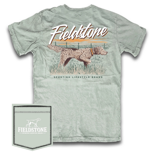 The Fieldstone English Setter Short Sleeve Pocket Tee is crafted from 100% cotton for lasting comfort and breathability. Designed with upland game enthusiasts in mind, it features a detailed English Setter in a classic pointing pose on the back and the Fieldstone logo embroidered on the front pocket. This tee combines durable natural fabric with understated style, making it an ideal choice for both field wear and casual outings.