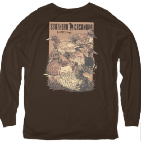 This long sleeve shirt from Southern Casanova Brand combines vintage style with durable comfort, crafted from soft cotton for a breathable fit. Designed with a classic brown duck decoy print, it reflects the spirit of duck hunting and outdoor life. Its pocket adds functionality, making it ideal for days spent at the duck blind or by the wood duck pond. Expertly tailored for hunters and outdoor enthusiasts who value authenticity and practical style.