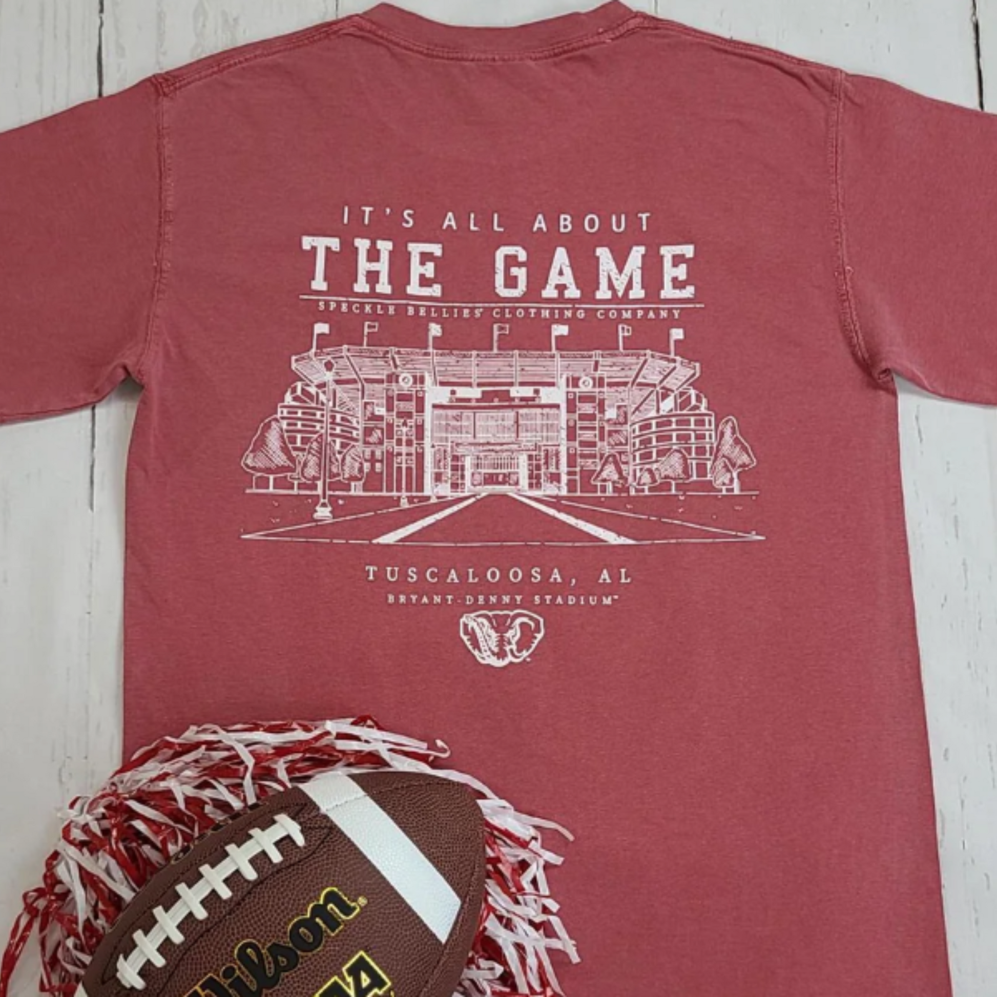 Show your Crimson Tide pride with the Speckle Bellie All About The Game Tee, crafted in Tuscaloosa. This short-sleeve cotton shirt features a soft Comfort Color fabric for lasting comfort, adorned with a bold Alabama logo and an iconic elephant graphic. Perfect for game days or casual wear, it delivers breathable durability while celebrating Alabama’s storied football tradition.