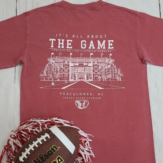 Show your Crimson Tide pride with the Speckle Bellie All About The Game Tee, crafted in Tuscaloosa. This short-sleeve cotton shirt features a soft Comfort Color fabric for lasting comfort, adorned with a bold Alabama logo and an iconic elephant graphic. Perfect for game days or casual wear, it delivers breathable durability while celebrating Alabama’s storied football tradition.