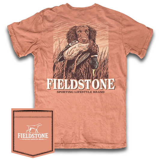 The Fieldstone "Fetch'em" Short Sleeve Pocket Tee combines classic outdoor style with premium comfort. Crafted from 100% cotton in a rich Burnt Orange, this tee features a detailed graphic of a Boykin Spaniel retrieving a mallard duck alongside the Fieldstone logo. Its breathable fabric and expert design make it ideal for casual wear or outdoor adventures, offering durability and a perfect fit that showcases your love for hunting and the outdoors.
