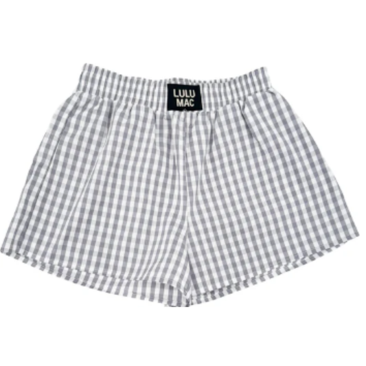 Lulu Mac Grey Gingham Shorts blend classic style with comfort, featuring a timeless grey gingham pattern ideal for versatile summer wear. Designed with practical pockets, these shorts offer functionality without compromising on style. Their soft, breathable fabric ensures all-day comfort, making them a perfect addition to any woman’s casual wardrobe.