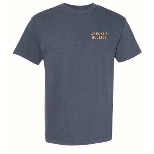 The Mallard Sunrise Short Sleeve Pocket T-shirt by Speckled Bellies features a vivid depiction of a mallard duck taking flight at sunrise, printed on a comfortable 100% cotton, Denim blue fabric. Designed for durability and breathability, this expert-crafted shirt offers both style and practicality, perfect for outdoor enthusiasts and casual wear alike. The added pocket enhances functionality without compromising its sleek look.