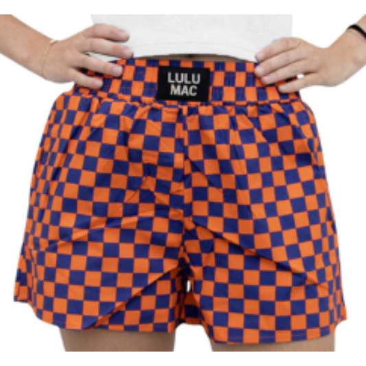 Elevate your game day wardrobe with the Lulu Mac Orange/Blue Checkered Shorts. Designed for women who value comfort and style, these boxer-style pocket shorts combine breathable fabric with a vibrant checkered pattern. Their tailored fit ensures freedom of movement, while convenient pockets add practical functionality. Perfect for spirited events or casual outings, these shorts offer a balance of fashion and ease that keeps you confident all day long.