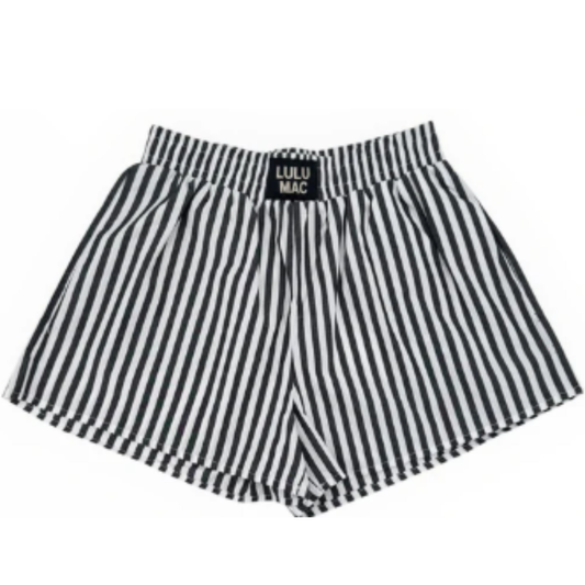 Lulu Mac Dark Grey Striped Shorts combine comfort and style with a classic boxer short design. Featuring dark grey and white stripes, these shorts offer a modern look while providing a cozy fit. The lightweight fabric and tailored cut make them perfect for everyday wear, and a convenient pocket adds practicality without compromising comfort. Ideal for casual settings, these shorts balance function and fashion effortlessly.